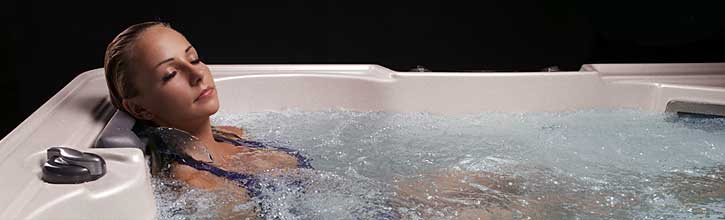 Woman relaxing in hot tub